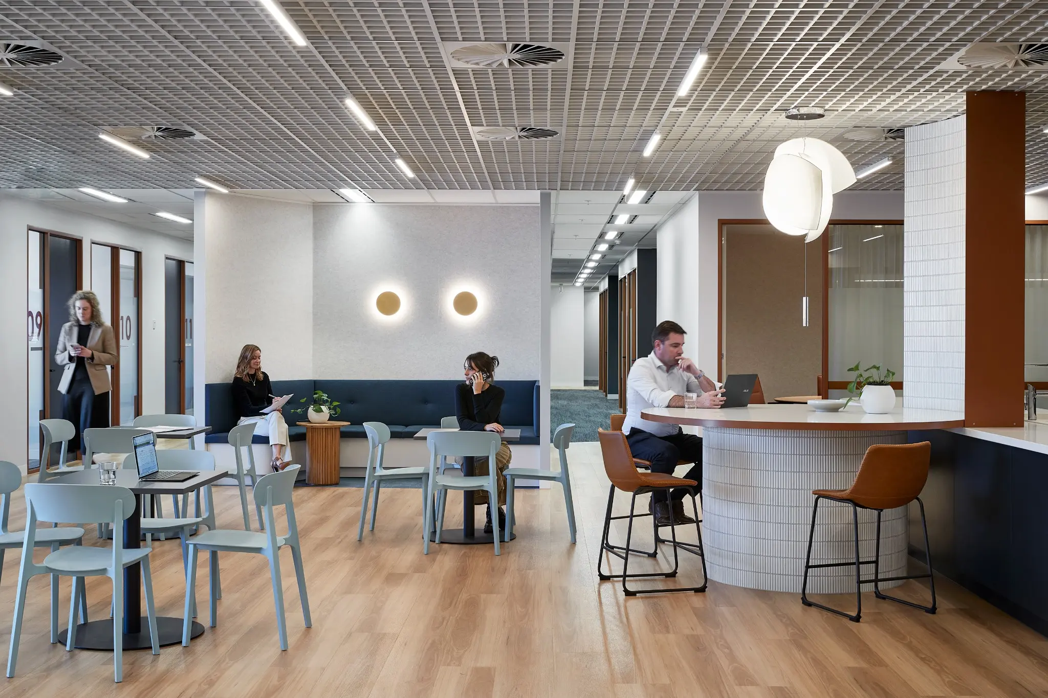 Growing professional team collaborating in a flexible workspace using coworking memberships