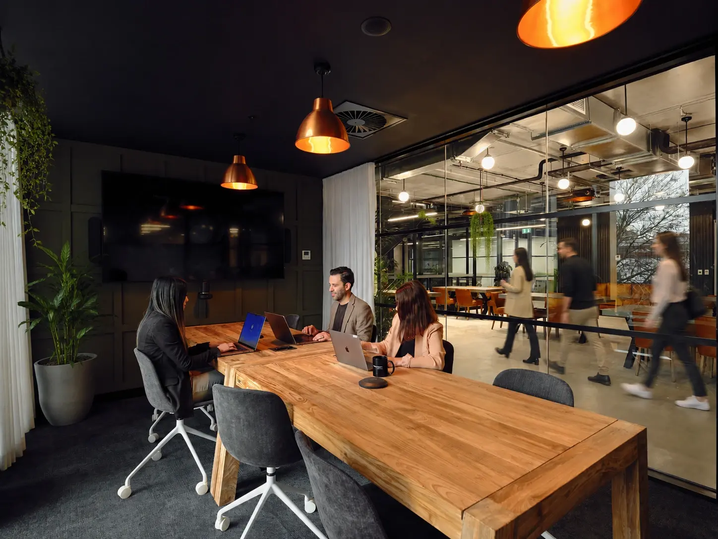 Corporate team using an enterprise coworking membership for a collaborative workshop in a professional Australian workspace